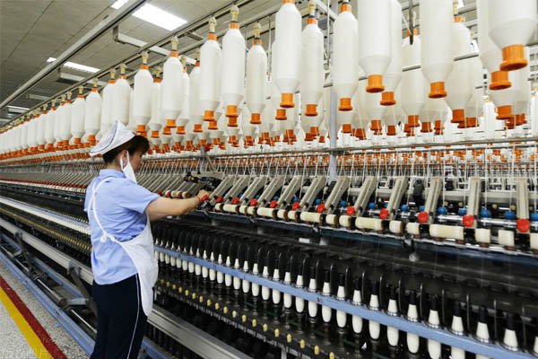 Spinning machine in a textile factory